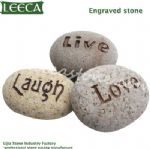 Cobble stone with words engraved stone