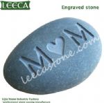 Cobble stone with words engraved stone