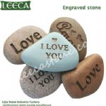 Cobble stone with words engraved stone